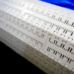 a closeup of the belt on the DC Norris North America belt tumble chiller