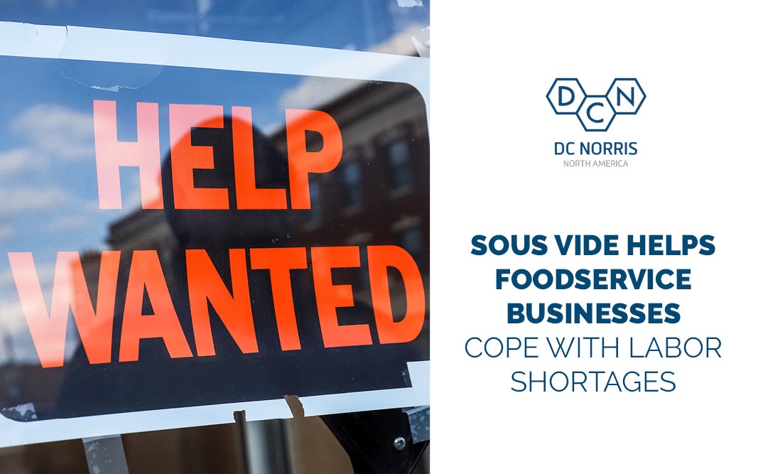 help wanted sign hanging in the window next to the blog title commercial sous vide equipment helps foodservice businesses cope with labor shortages