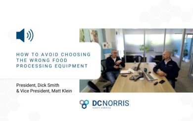 Matt Klein and Dick Smith meet at a conference room table in the DC Norris North America offices. There's a headline that reads "how to avoid choosing the wrong food processing equipment". The DC Norris North America logo is at the bottom