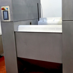 belt tumble chiller in off mode, showing the white belt and HMI panel