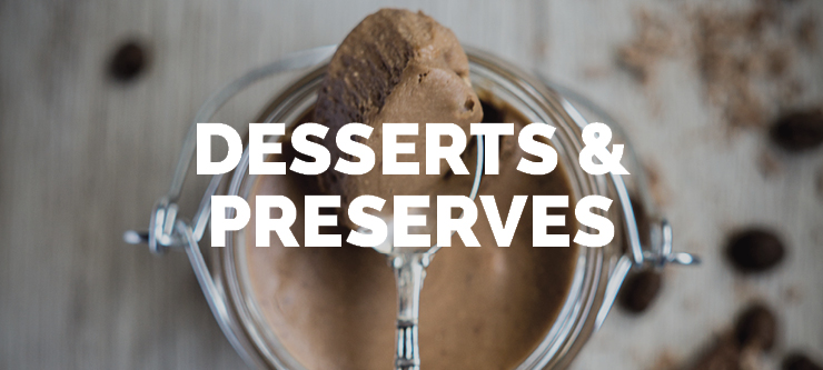 chocolate mousse in a glass jar with a spoon full on top showcasing the type of products that the equipment DC Norris North America sells can manufacture in the desserts and preserves category