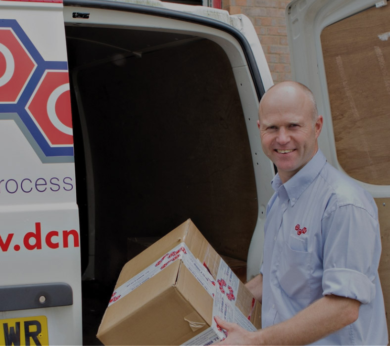 a DC Norris service technician delivers spare parts for custom industrial food processing equipment