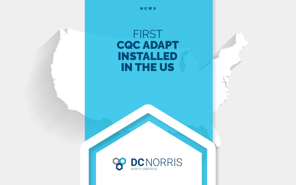 white outlined image of the united states of america behind a headline that reads "first cqc adapt installed in the us" above the DC Norris North America logo