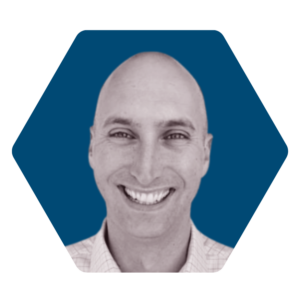 mattklein-dcnorris DC Norris North America's Vice President, Matt Klein. The image is black and white and the background is a navy blue hexagon
