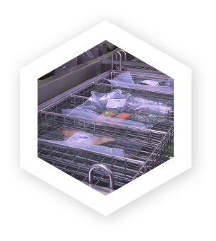 Industrial sous vide water bath cooking salmon in sealed pouches