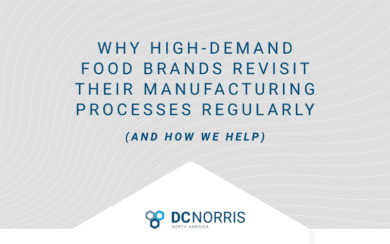 a light gray background is behind a headline that reads 'Why High Demand Food Brands Revisit Their Manufacturing Processes Regularly (and how we help). The DC Norris North America logo is at the bottom of the gray box.